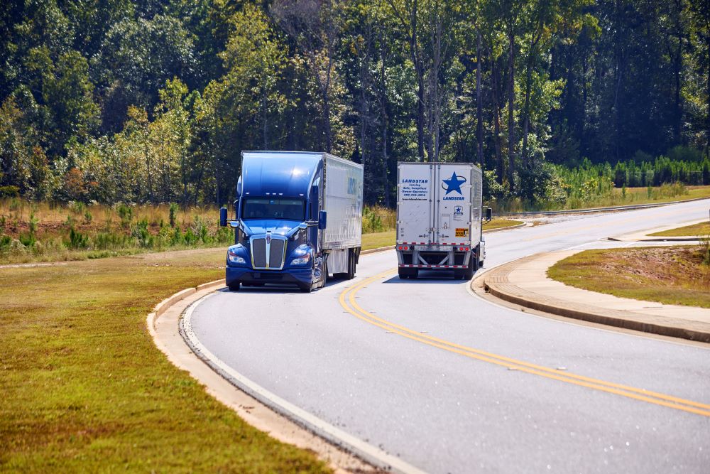 Two trucks passing by