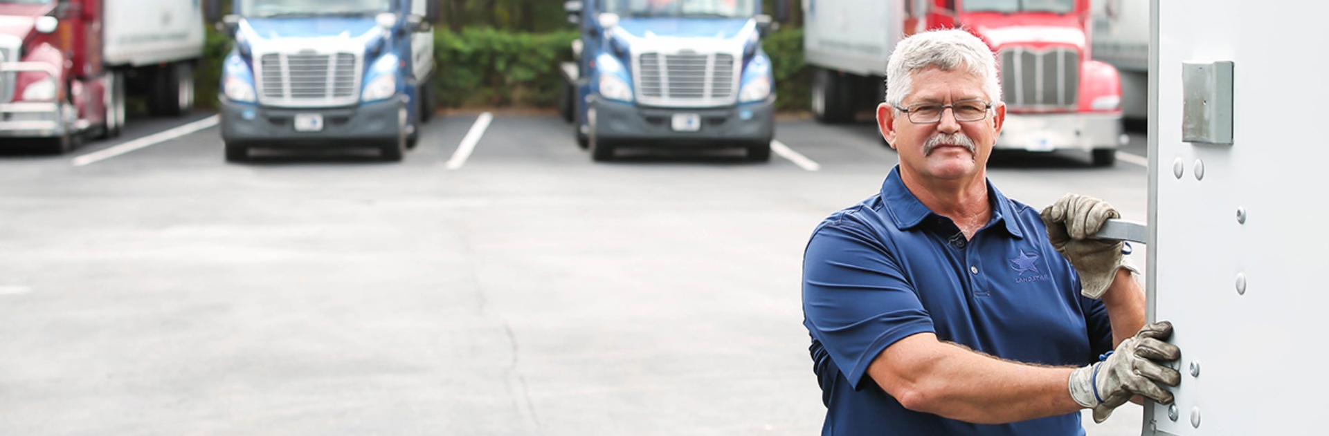 Image of driver opening a trailer door for freight loading and unloading in Canada